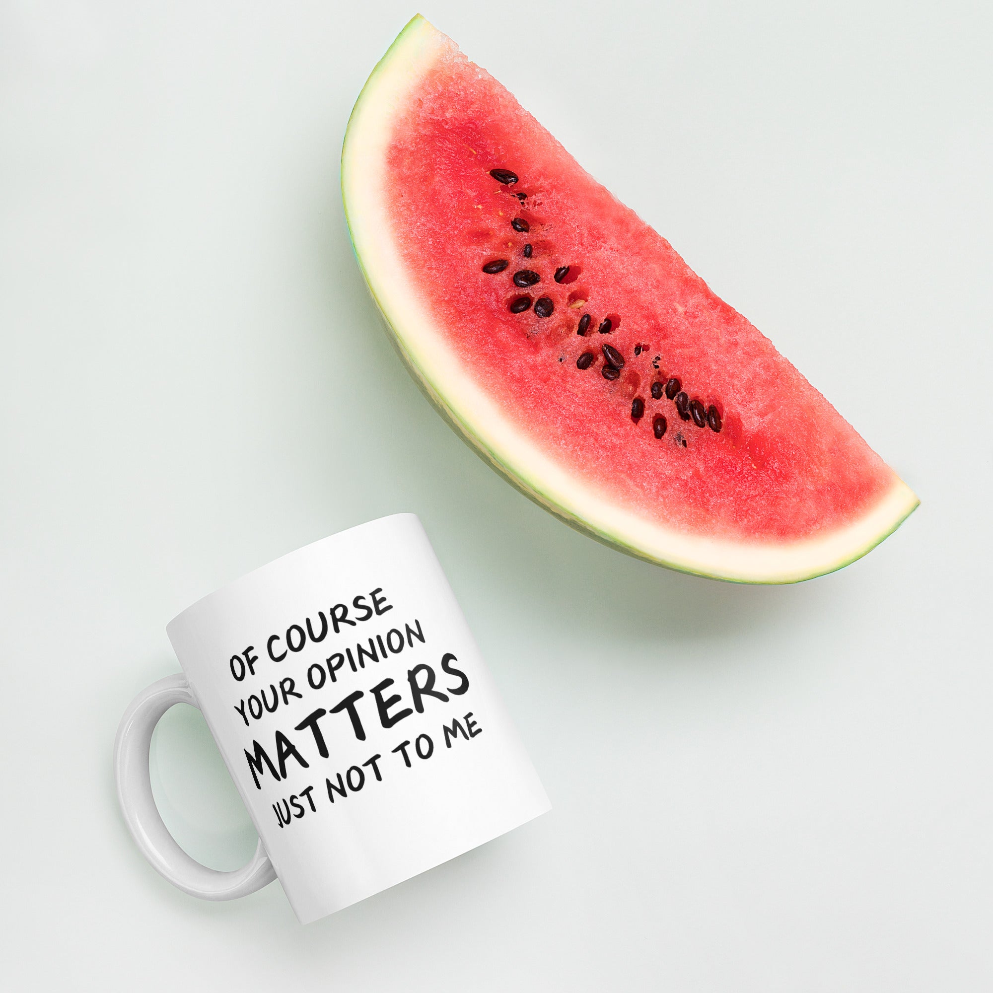 "White ceramic coffee mug with black text saying Of Course Your Opinion Matters Just Not to Me"