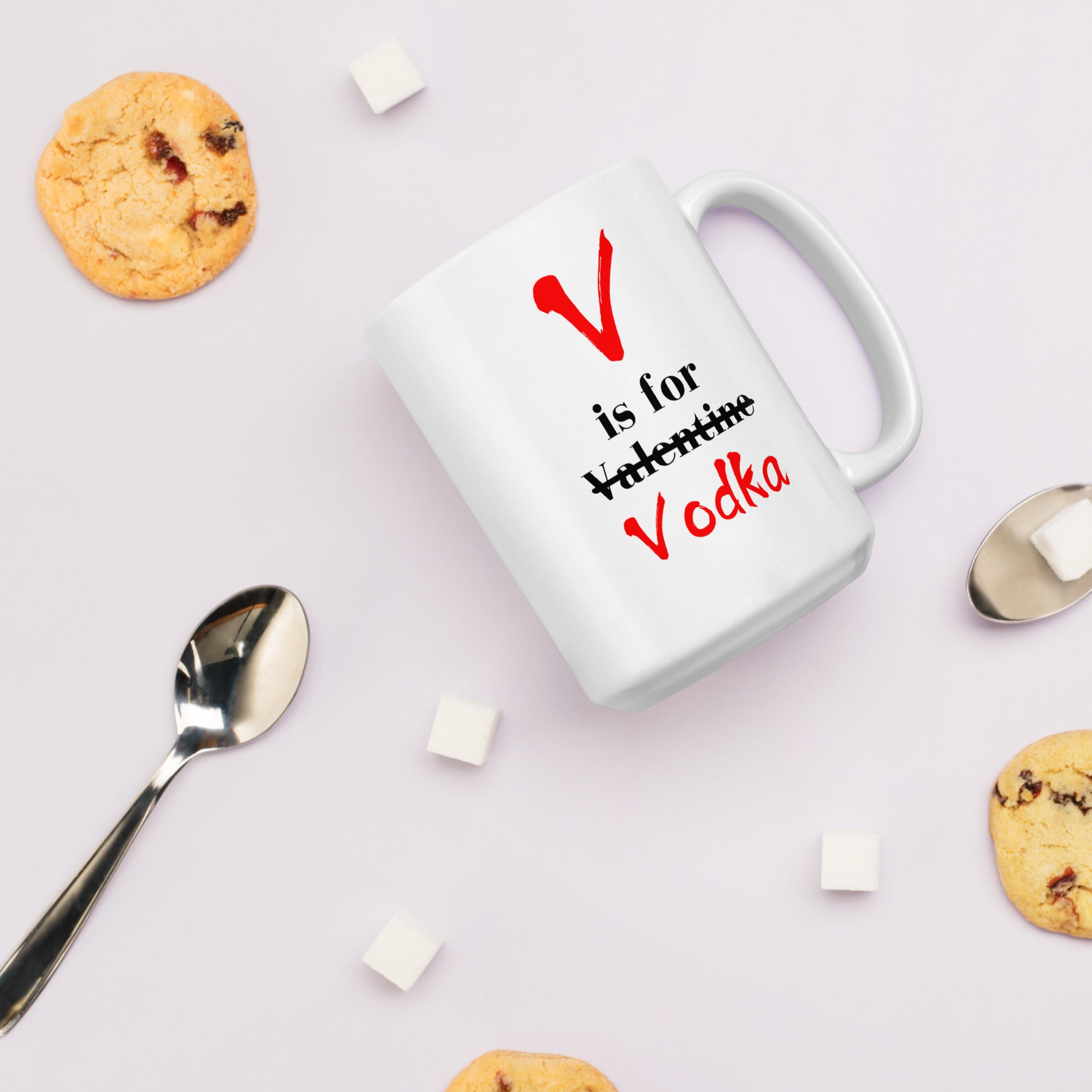"White ceramic coffee mug with black text saying V Is For Valentine crossed out Vodka"