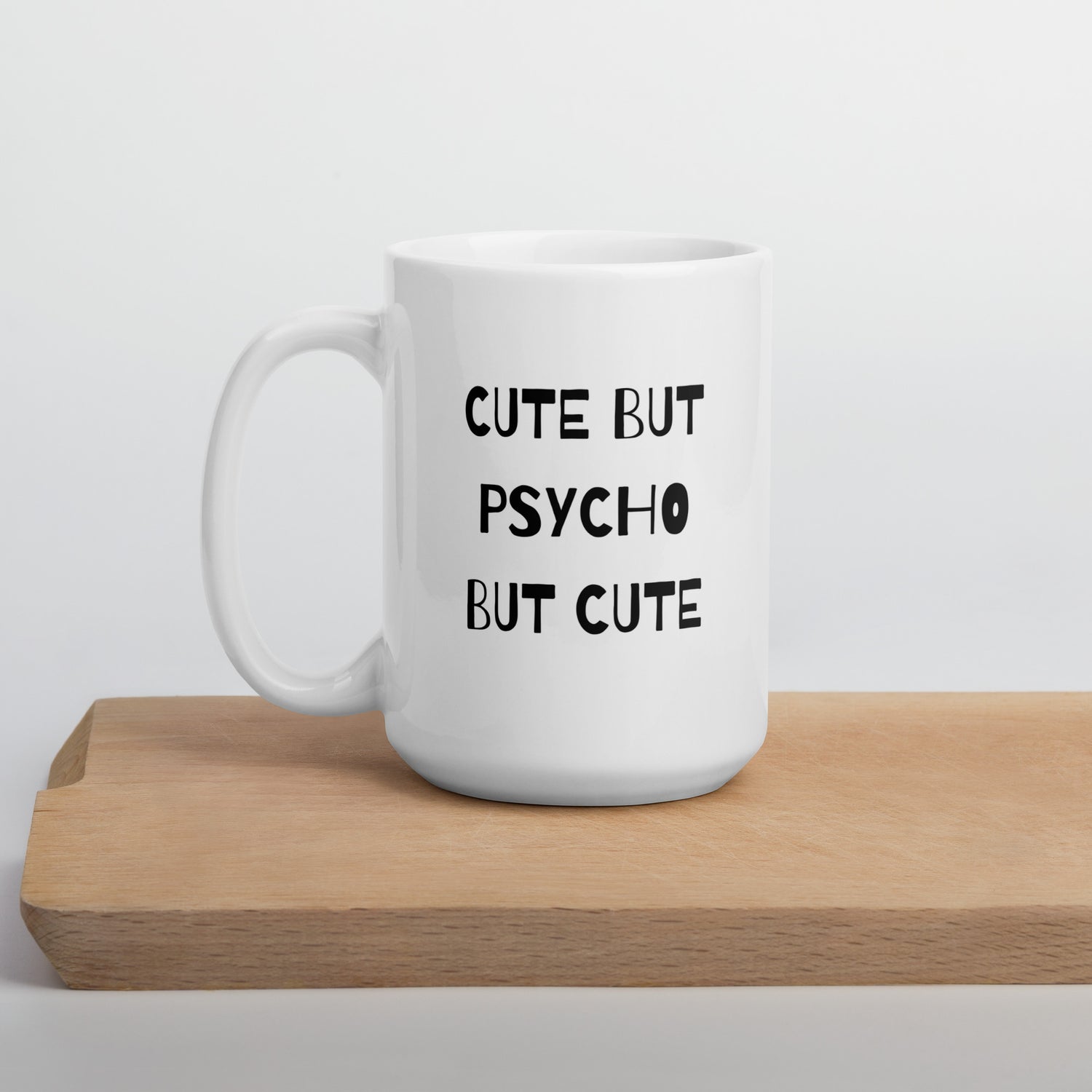 A white ceramic mug with the text &