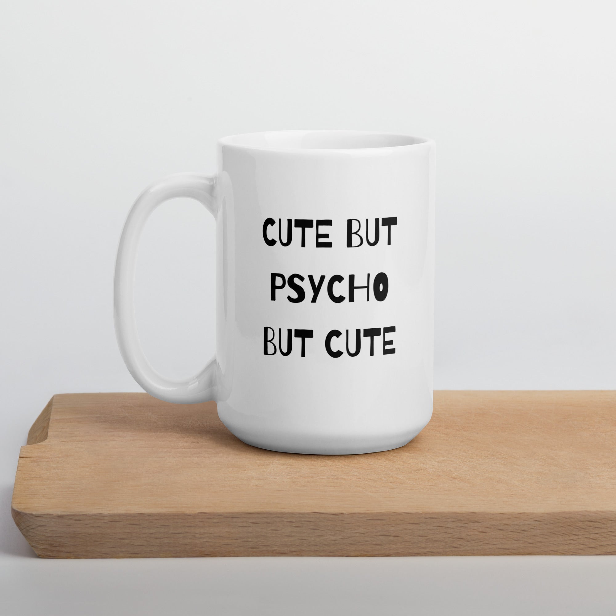 A white ceramic mug with the text &