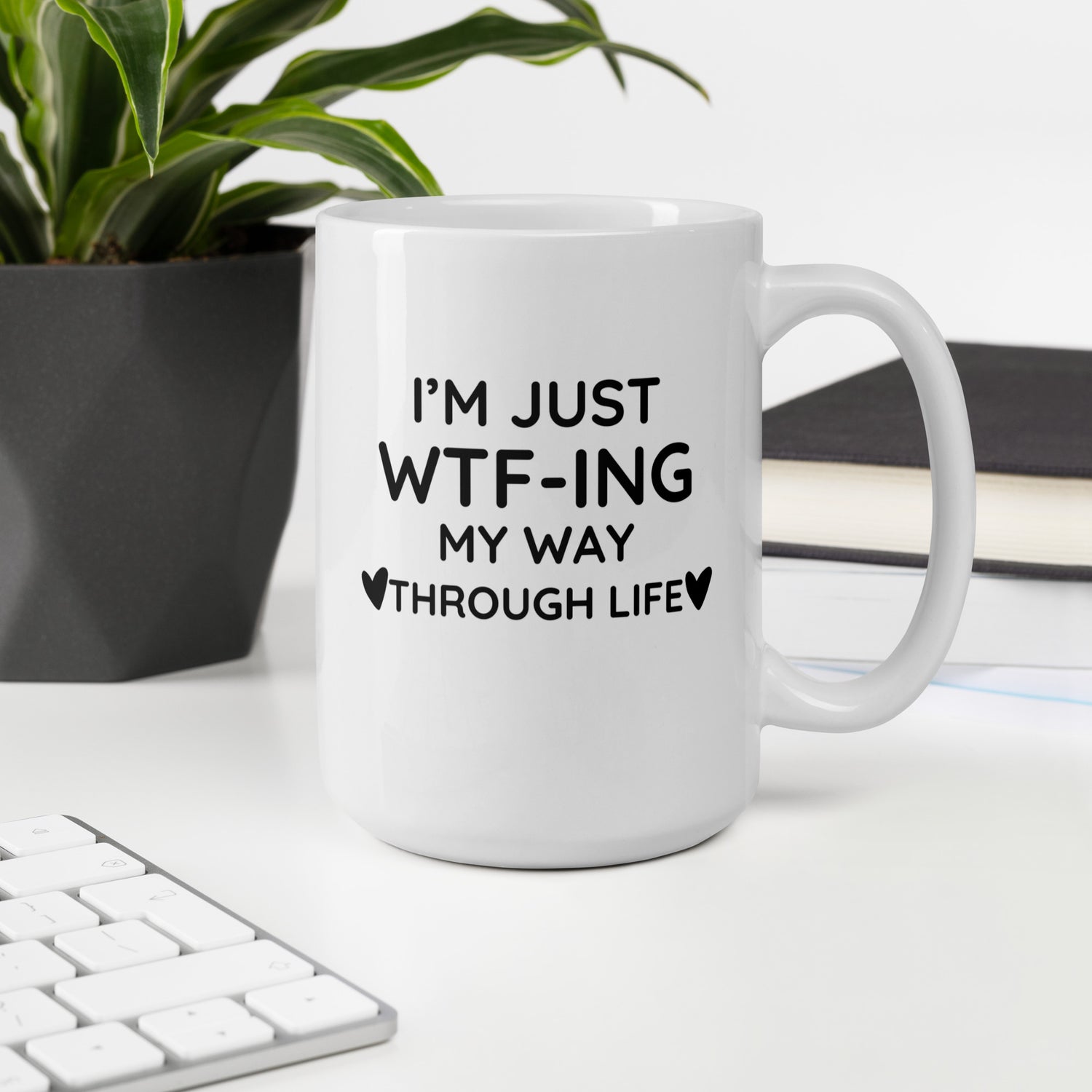 "White ceramic coffee mug with black text saying I&