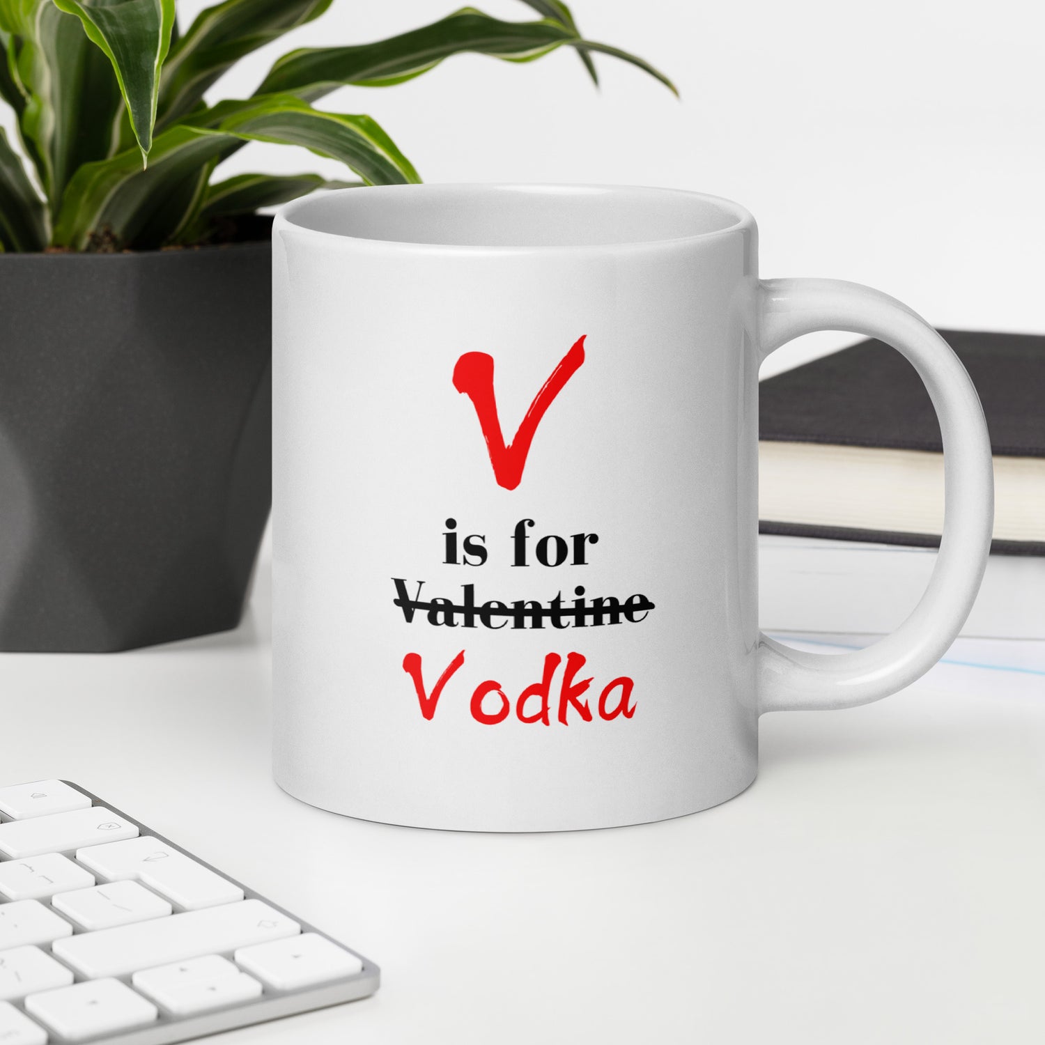 "White ceramic coffee mug with black text saying V Is For Valentine crossed out Vodka"