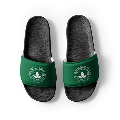 Black slides with green straps on a white background
