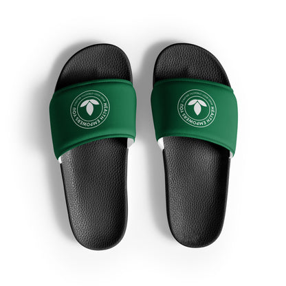 Black slides with green straps featuring a logo on a white background