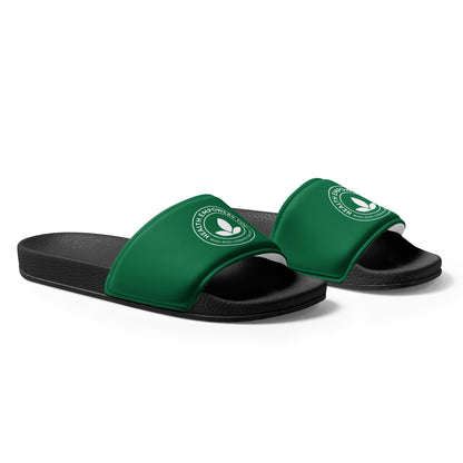 Green slides with black soles on a white background